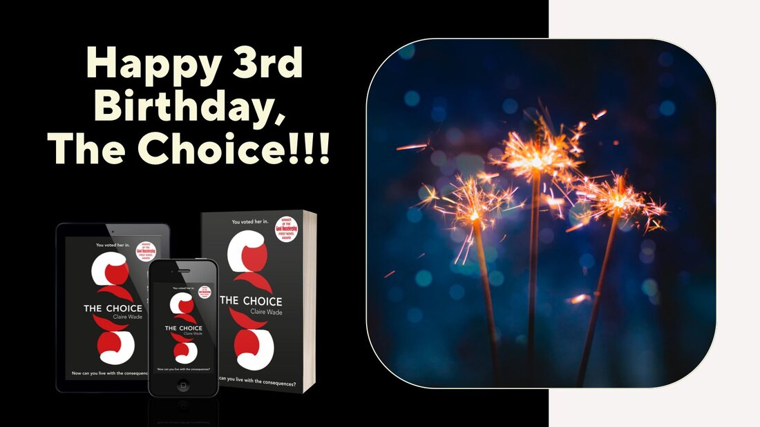 Three copies of The Choice one early reader, one on a phone and one in paperback, beside three lit sparklers.